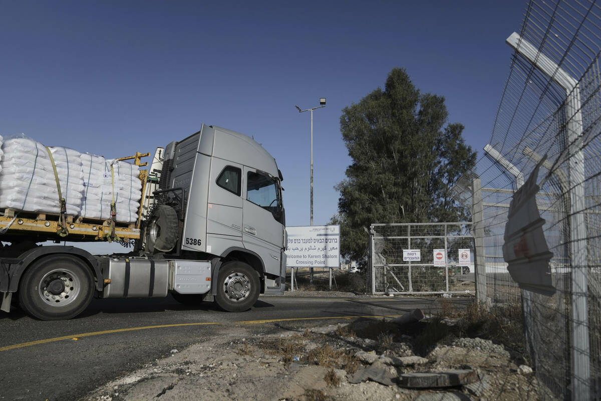 A truck carrying humanitarian aid for the Gaza Strip enters to Kerem Shalom Crossing in souther ...