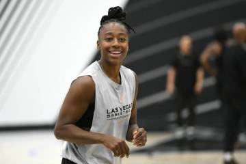 Jewell Loyd smiles during the Las Vegas Aces first day of training camp Sunday, April 27, 2025, ...