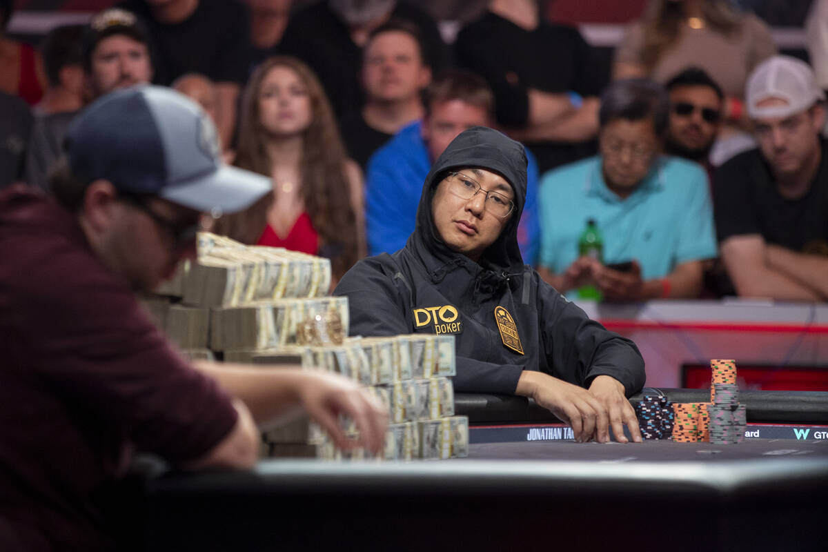 Jonathan Tamayo, right, watches Jordan Griff, left, place a bet in the final table of the World ...