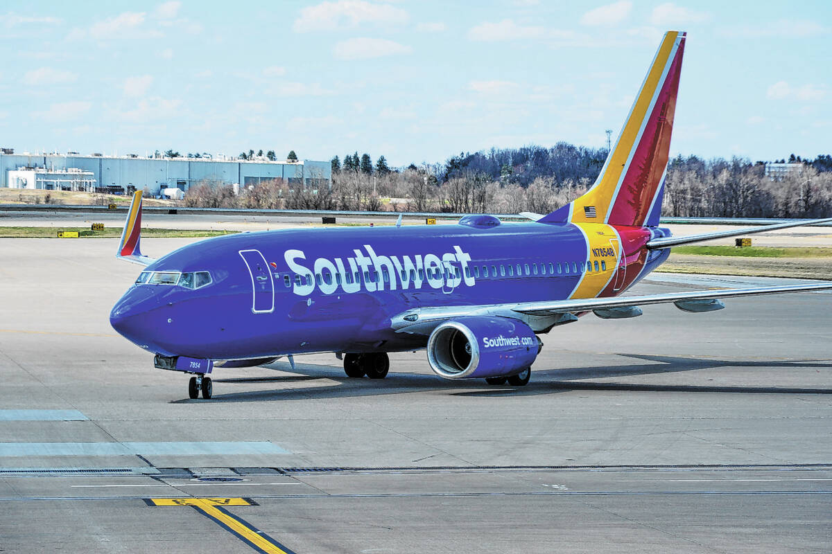 FILE - A Southwest Airlines plane pull into a gate at Pittsburgh International Airport in Imper ...