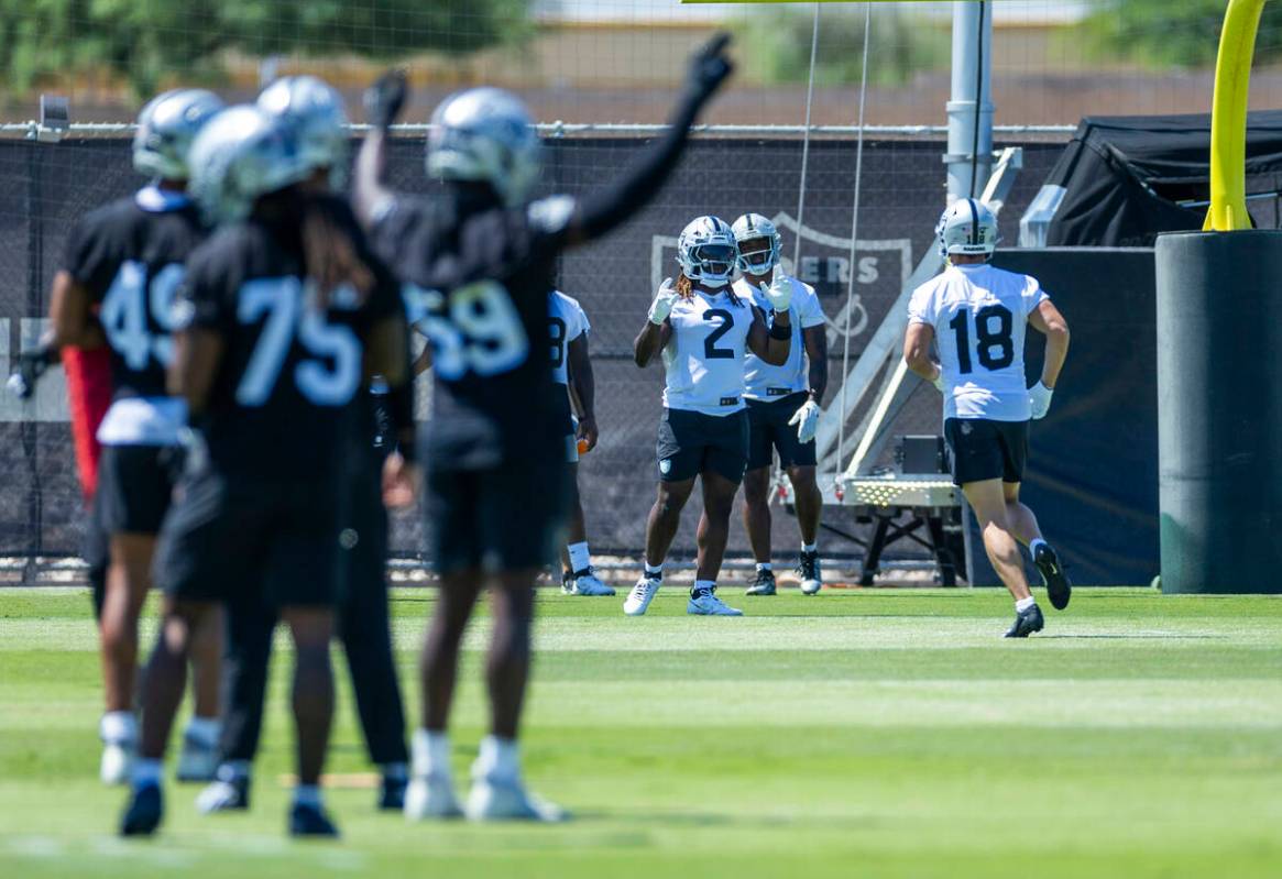 Raiders running back Ashton Jeanty (2) looks to wide receiver Jack Bech (18) during Raiders OTA ...
