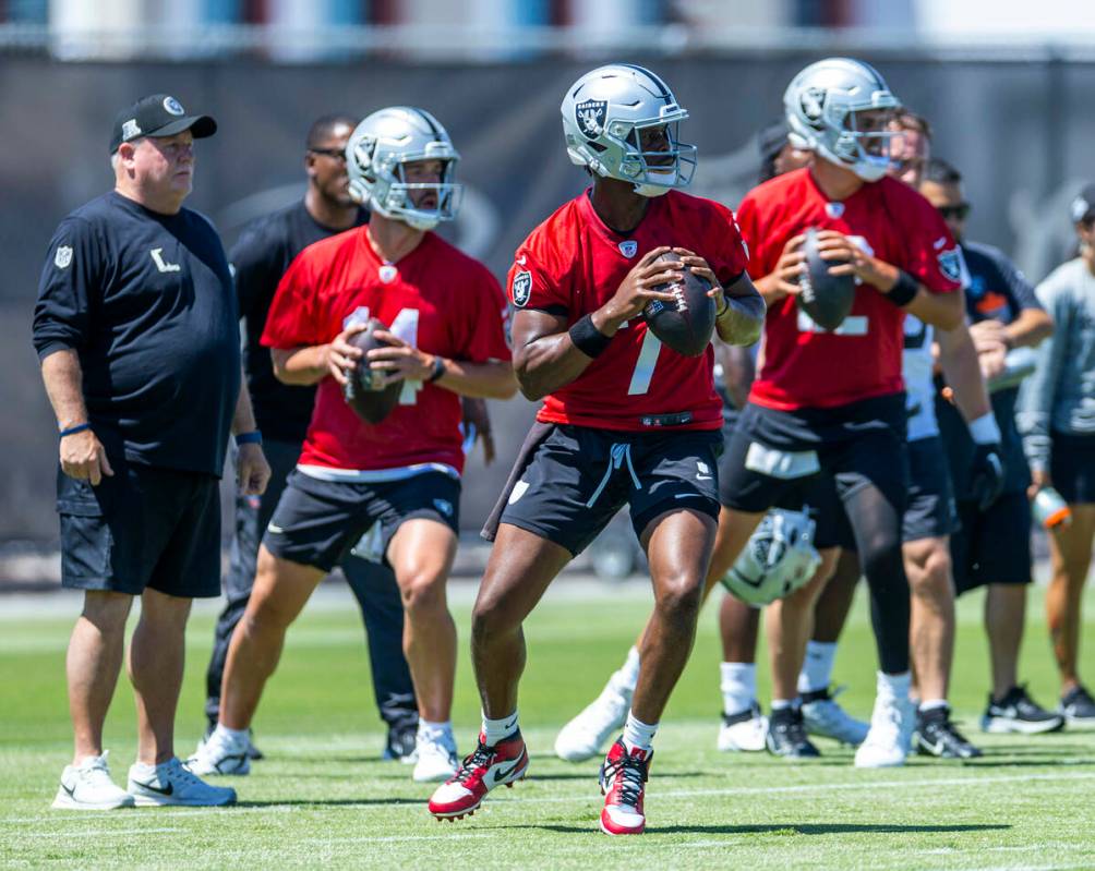 Raiders quarterbacks Geno Smith (7), center, Carter Bradley (14) and Aiden O'Connell (12) look ...