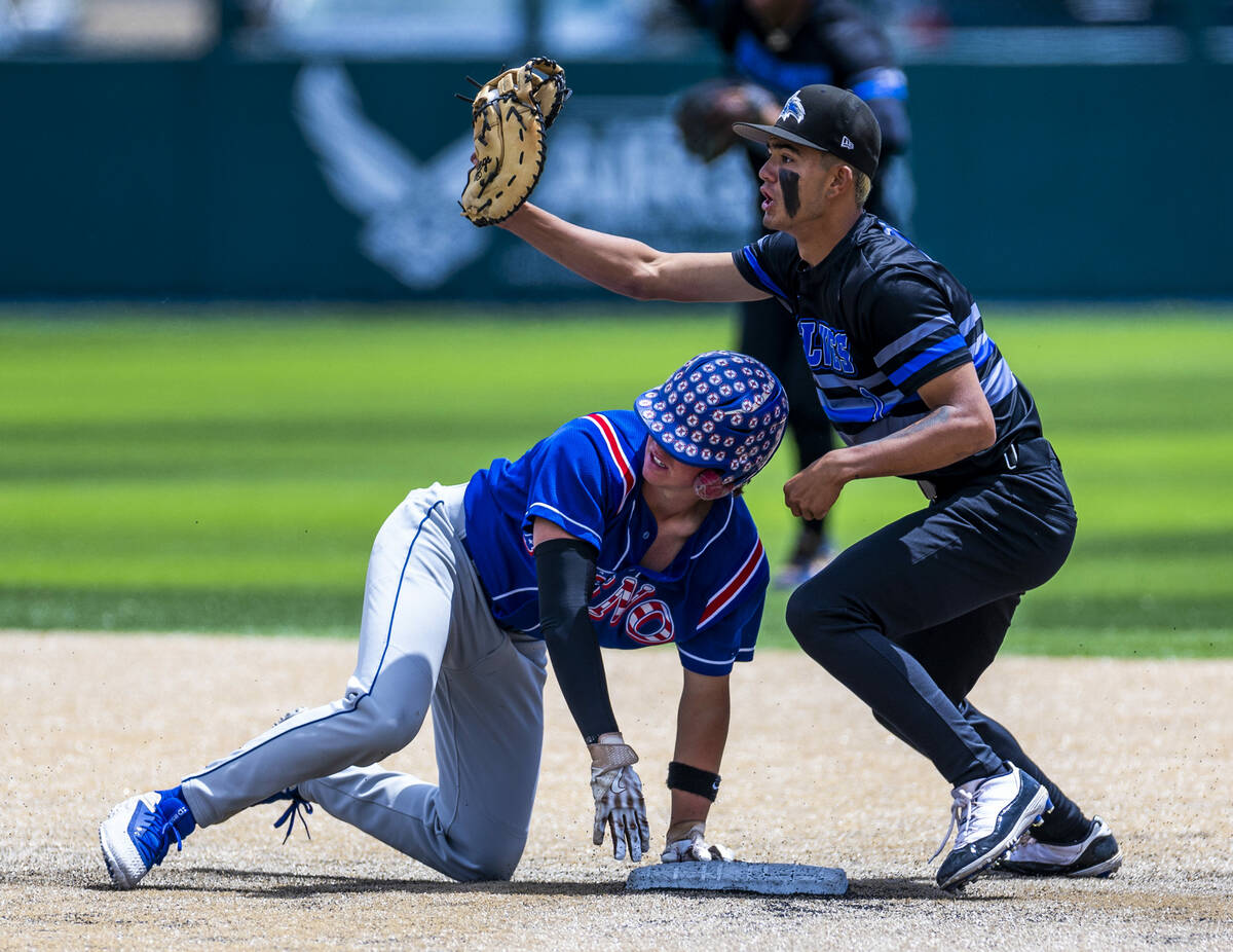 Basic infielder Adrian Ramos (1) shows the official he has the ball for an out at second base a ...