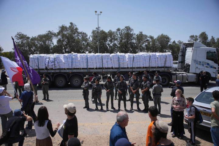 A truck loaded with humanitarian aid for the Gaza Strip makes its way to the Kerem Shalom cross ...