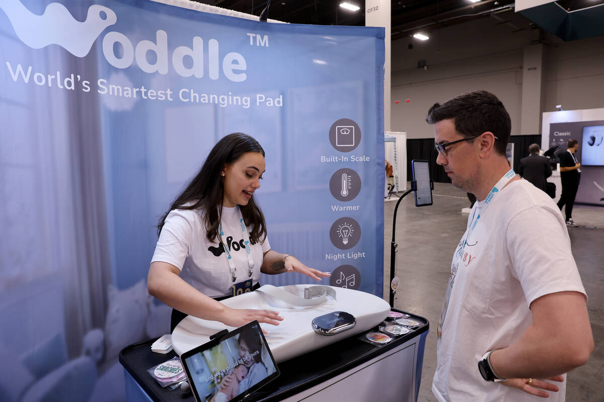 Jennifer Whitehurst with Woddle Smart Changing Pad talks to Bobby Johnson of Pepper Pike, Ohio, ...