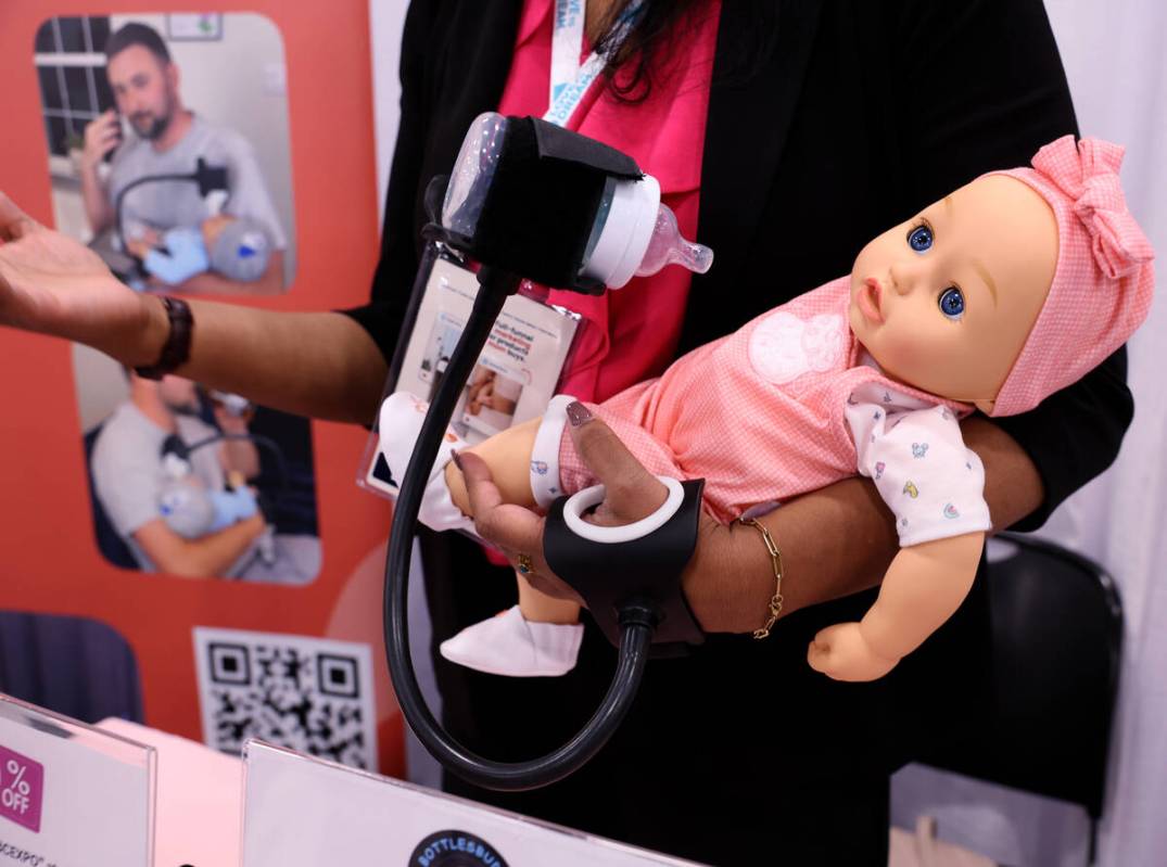 BottlesBuddy co-founder Anusha Devassy demonstrates her baby bottle holder during the ABC Kids ...