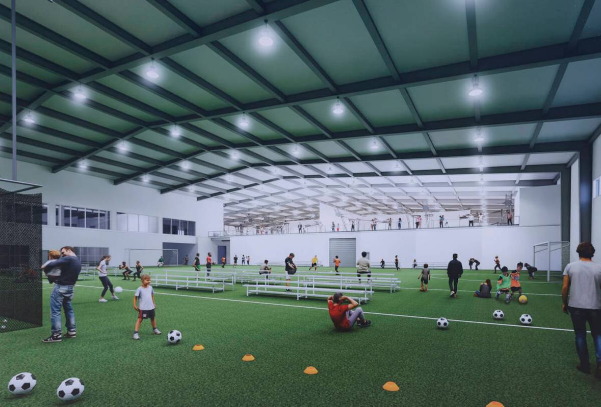 An artist rendering of the future of West Henderson Fieldhouse is displayed during groundbreaki ...