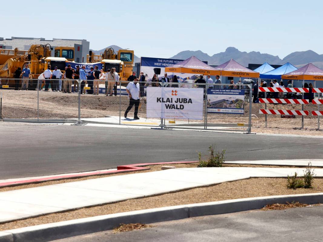 Guests are gathered at the site where the future of West Henderson Fieldhouse will be built dur ...
