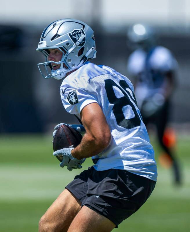 Raiders tight end Brock Bowers (89) secures a pass catch during Raiders OTA practice at the Int ...