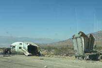 The truck and trailer involved in the accident. Collision with the stone building resulted in t ...