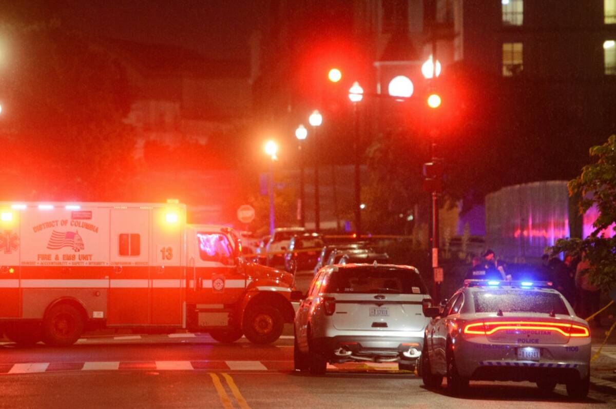 Law enforcement work the scene after two staff members of the Israeli Embassy in Washington wer ...