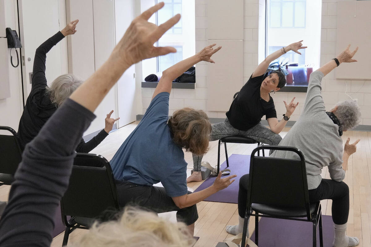Whitney Chapman, right, conducts a chair yoga class at the Marlene Meyerson JCC Manhattan, in N ...
