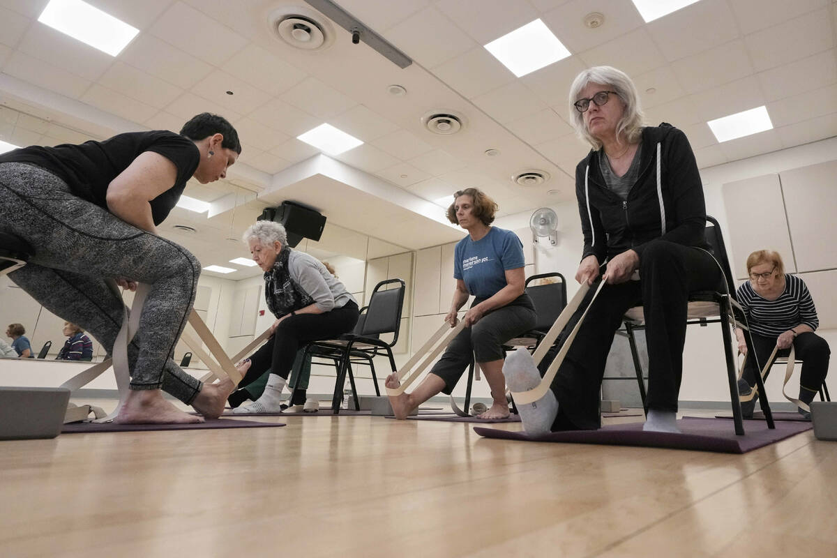 Whitney Chapman, left, conducts a chair yoga class at the Marlene Meyerson JCC Manhattan, in Ne ...