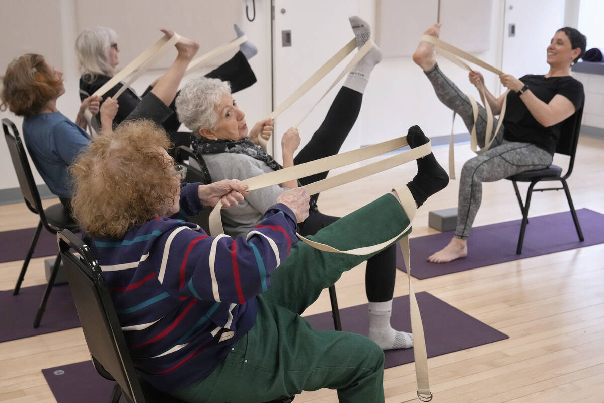 Whitney Chapman, right, conducts a chair yoga class at the Marlene Meyerson JCC Manhattan, in N ...