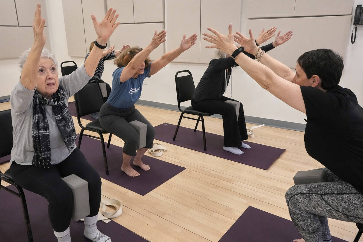 Whitney Chapman, right, conducts a chair yoga class at the Marlene Meyerson JCC Manhattan, in N ...