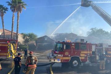 Las Vegas Fire & Rescue crews work to contain a house fire Thursday, May 22, 2025, in the 10000 ...