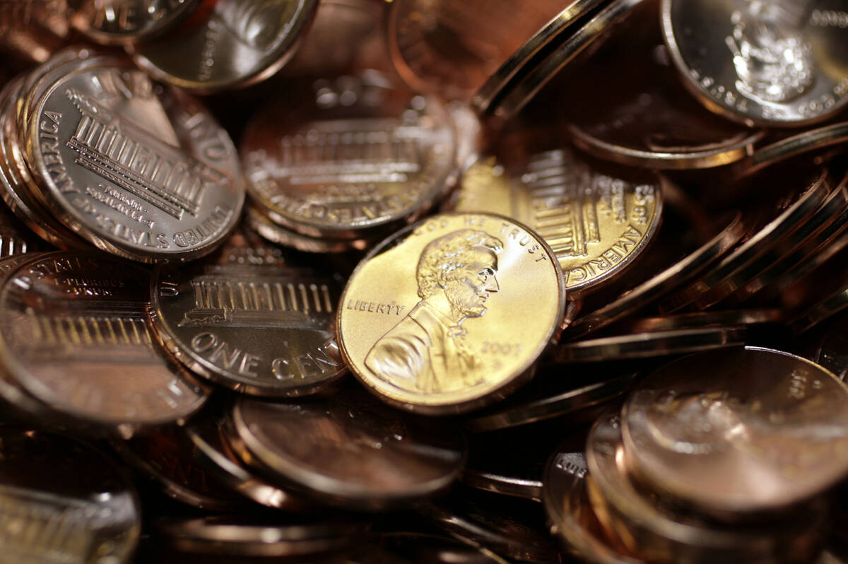 Freshly-made pennies sit in a bin at the U.S. Mint in Denver on Aug. 15, 2007. (AP Photo/David ...