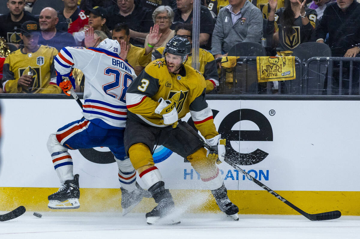 Edmonton Oilers right wing Connor Brown (28) and Golden Knights defenseman Brayden McNabb (3) b ...
