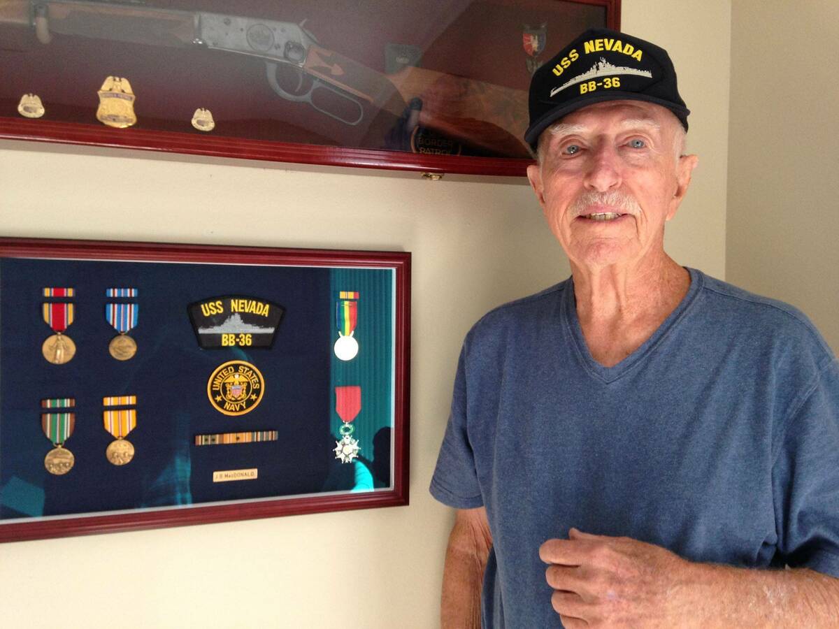 Joe MacDonald poses with medals he received for his service on the U.S.S. Nevada. MacDonald, wh ...