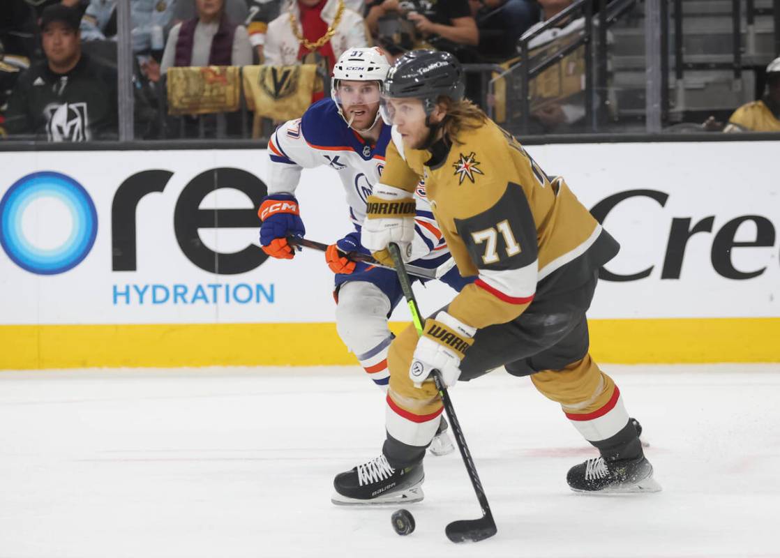 Golden Knights center William Karlsson (71) skates with the puck under pressure from Edmonton O ...