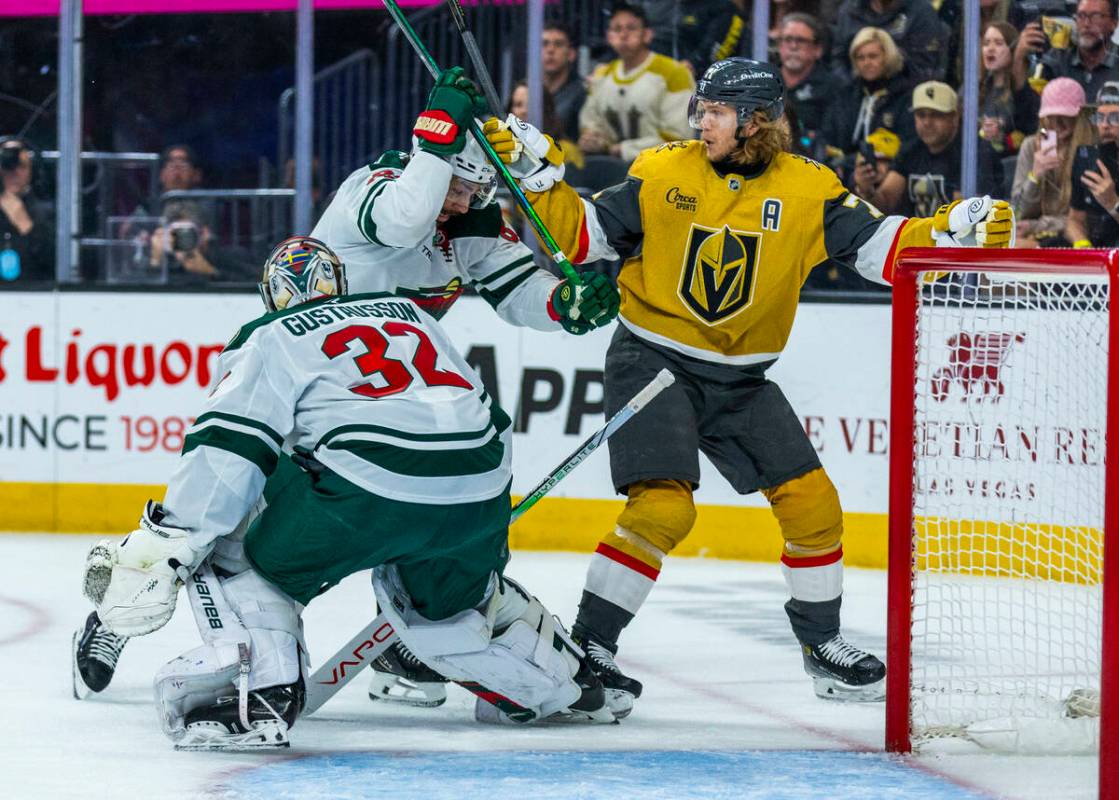Golden Knights center William Karlsson (71) battles for position near the goal against Minnesot ...