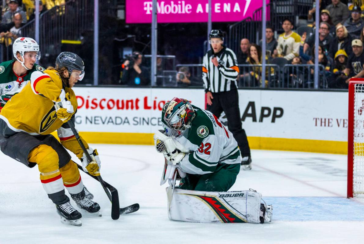 Golden Knights center William Karlsson (71) has a shot grabbed by Minnesota Wild goaltender Fil ...
