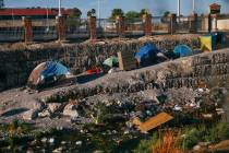 Homeless encampments sit along the wash behind Target, close to the corner of Flamingo Road and ...
