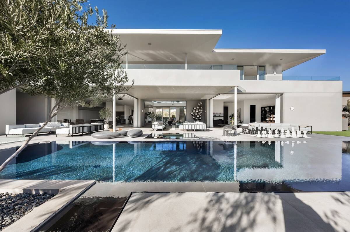 Located at 14 Magic Stone Lane, the home was listed for $16.95 million and sold for $14.7 milli ...