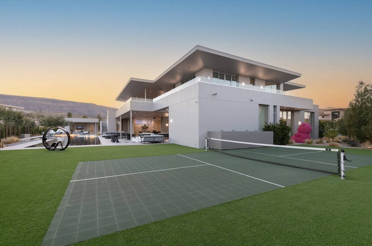 Located at 14 Magic Stone Lane, the home was listed for $16.95 million and sold for $14.7 milli ...