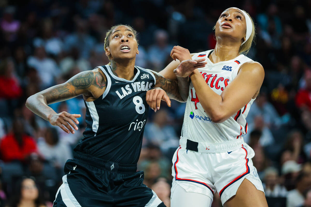 Aces forward Crystal Bradford (8) goes out Washington Mystics forward Kiki Iriafen (44) during ...