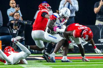 Boise State Broncos running back Ashton Jeanty (2) nearly fumbles the ball after a hit by UNLV ...
