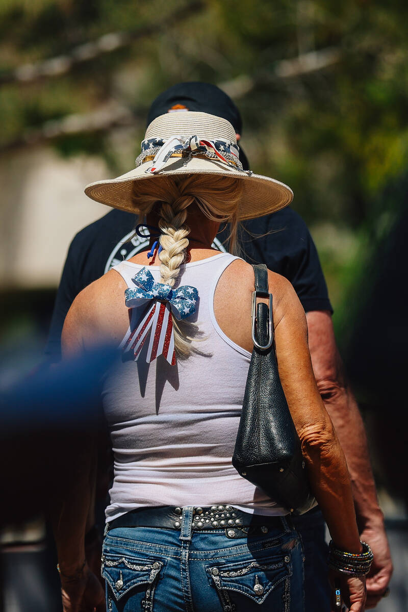 A person wears an American themed bow in their hair during a special forces ceremony in honor o ...