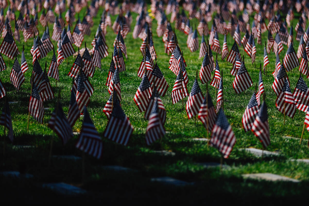 Flags flow at veteran graves during a special forces ceremony in honor of Memorial Day weekend ...