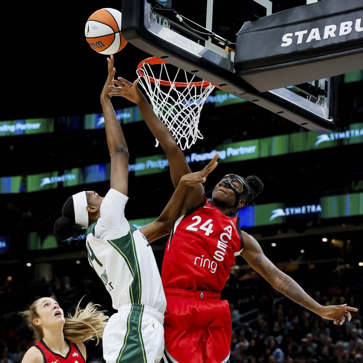 Las Vegas Aces guard Jewell Loyd tries to contest a shot by Seattle Storm center Dominique Malo ...