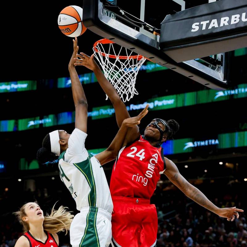 Las Vegas Aces guard Jewell Loyd tries to contest a shot by Seattle Storm center Dominique Malo ...