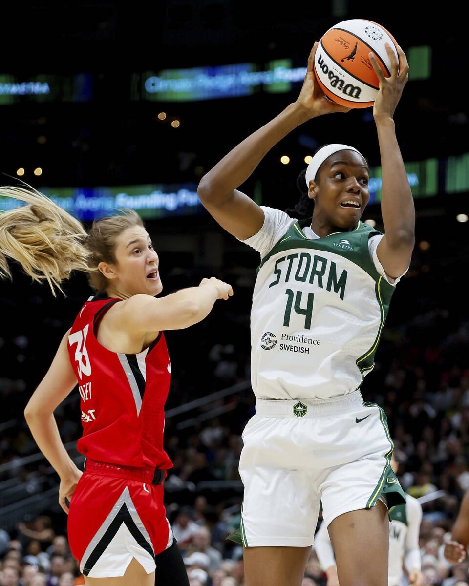 Seattle Storm center Dominique Malonga gets past Las Vegas Aces center Elizabeth Kitley during ...