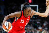 Las Vegas Aces guard Chelsea Gray gets poked in the eye by Seattle Storm forward Gabby Williams ...