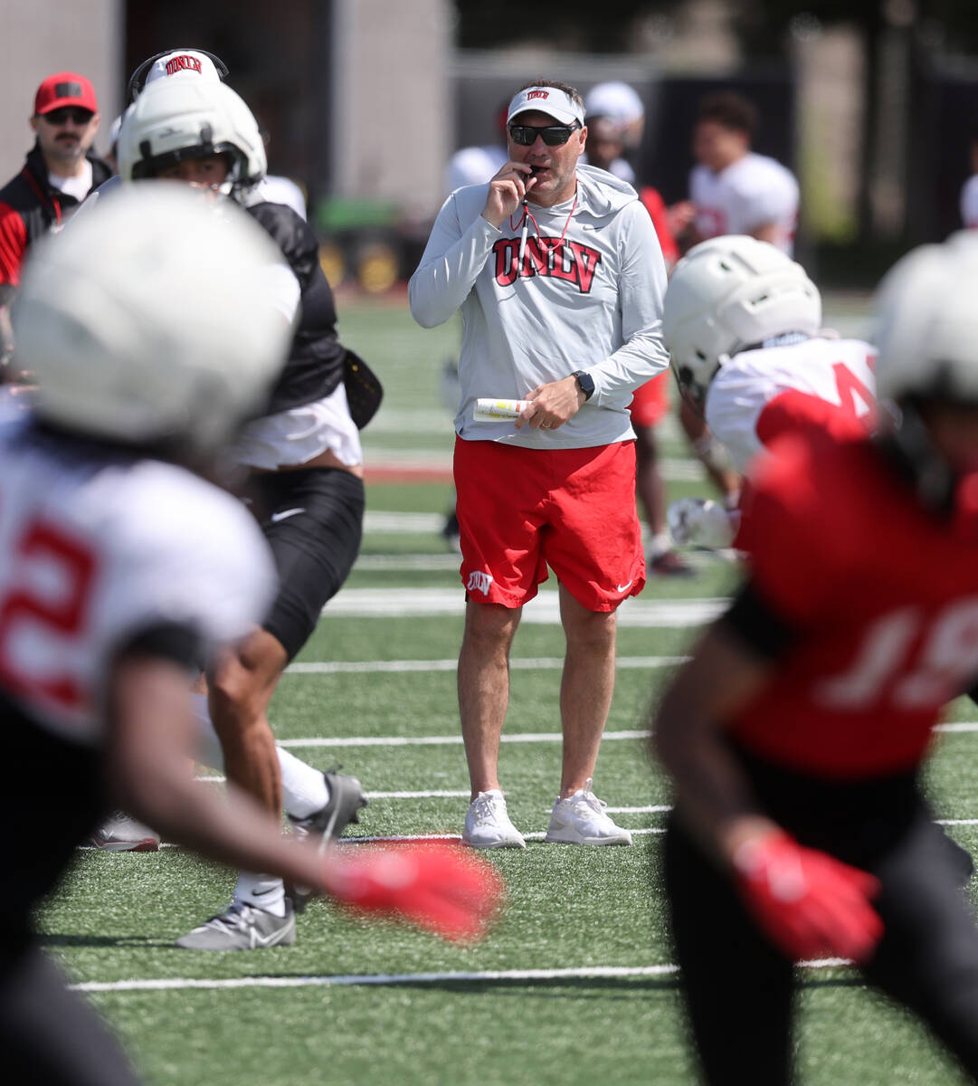 UNLV coach Dan Mullen watches his team scrimmage at Bill 'Wildcat' Morris Rebel Park in Las Veg ...