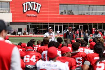 UNLV coach Dan Mullen talks to his team after a scrimmage at Bill 'Wildcat' Morris Rebel Park i ...