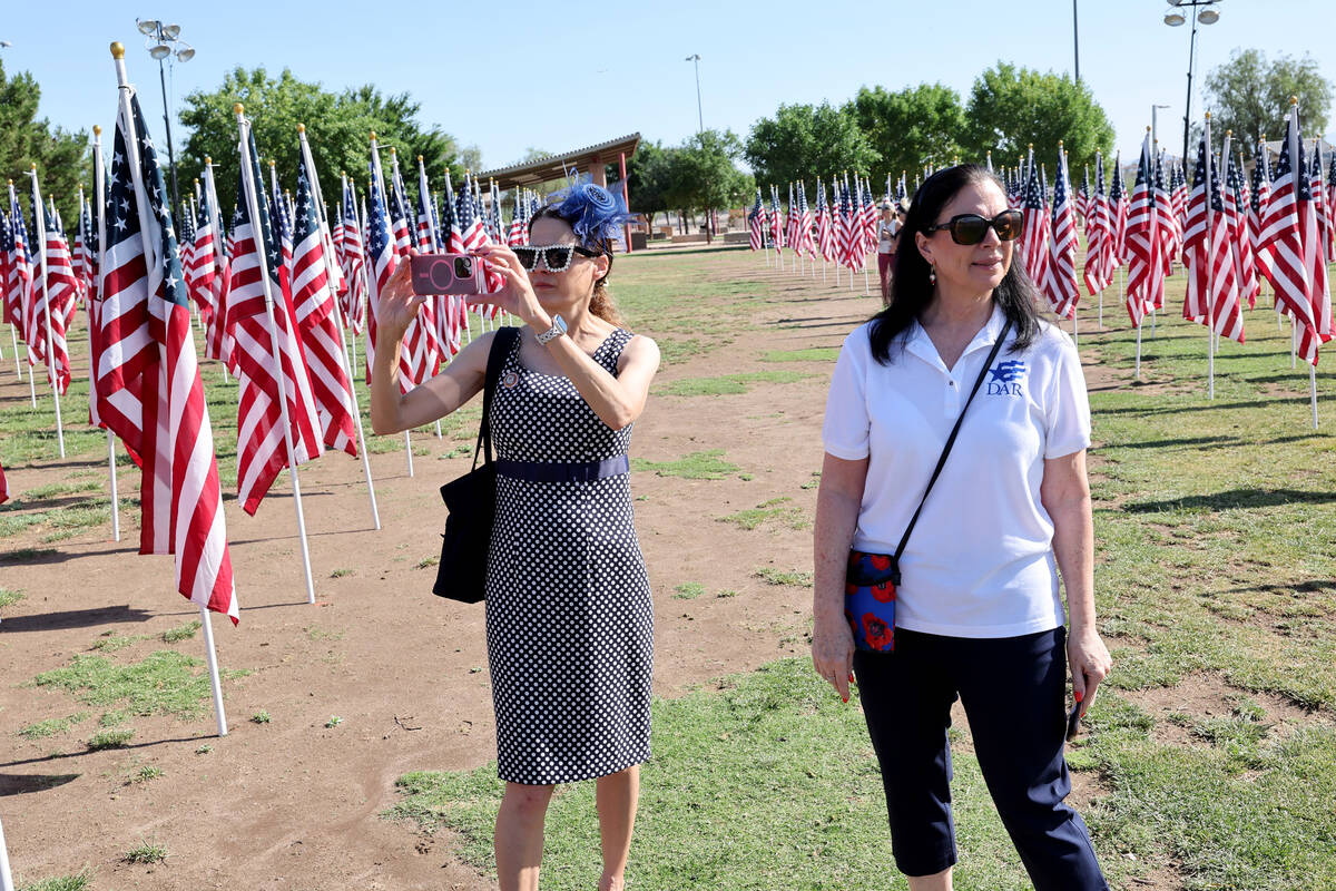 Kristen Johnson, left, and Kelli Reed, who are members of Daughters of the Revolution, walk amo ...