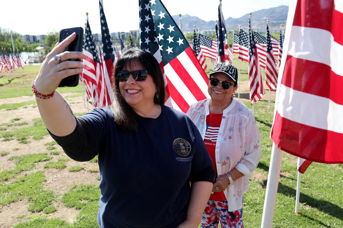 Air Force veteran Leiandra Gaskill, left, and her mother Judy Siqueiros take a selfie among fla ...