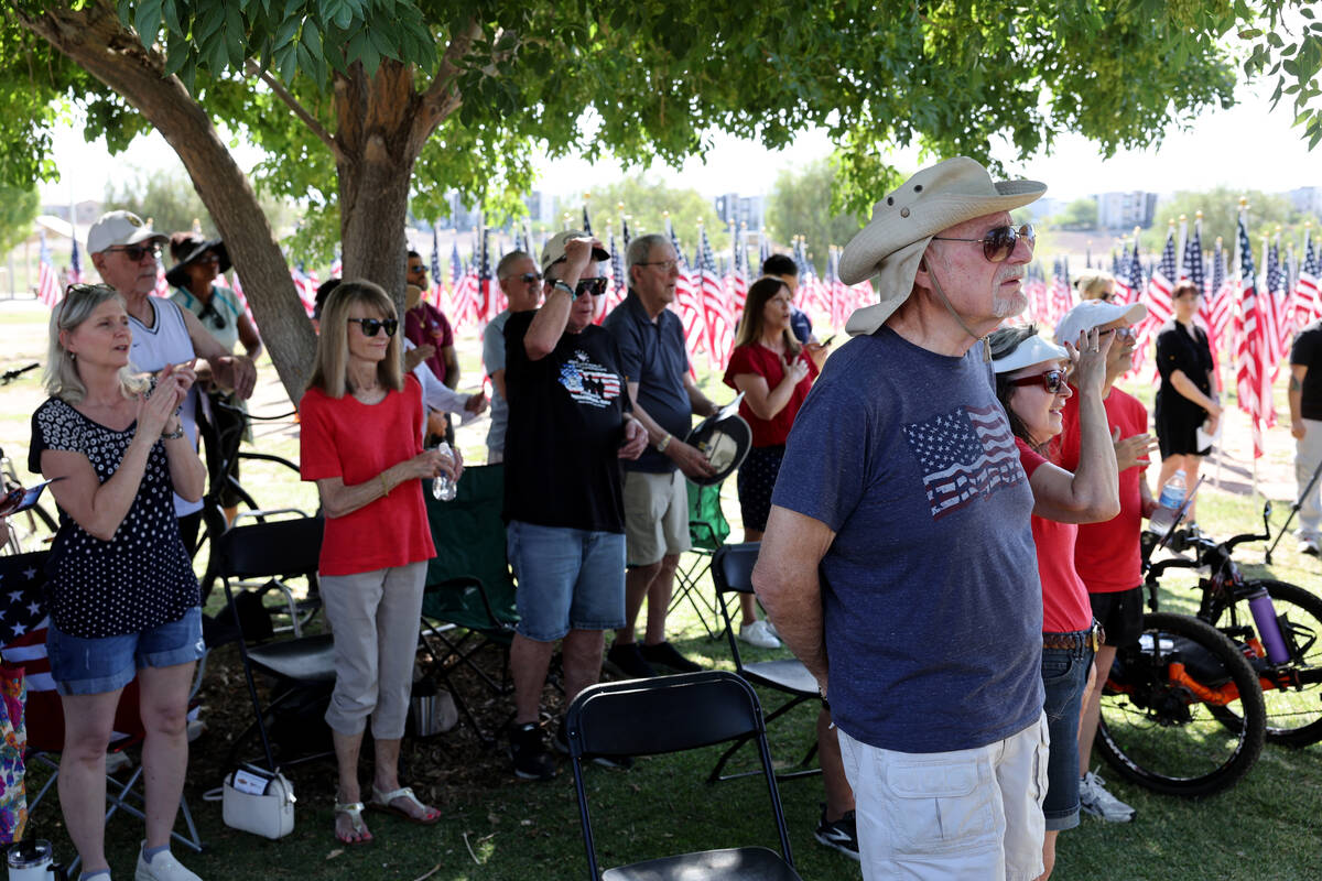 Audience members stand during the Field of Honor ceremony at Cornerstone Park in Henderson on M ...