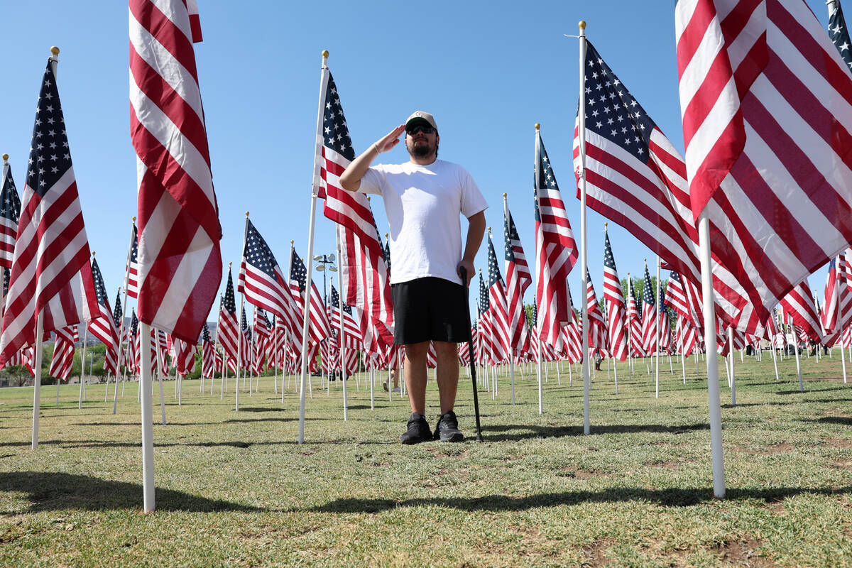 Army 101st Airborne Division veteran Alexander Rincon salutes during the Field of Honor ceremon ...