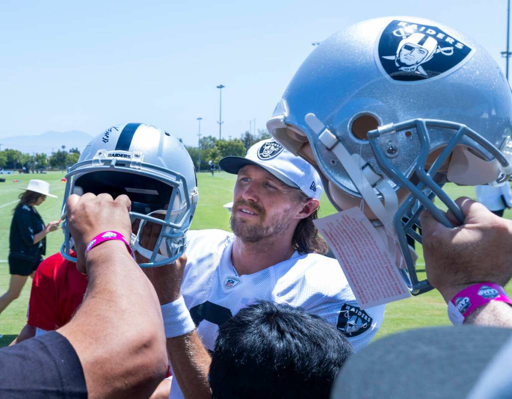 Raiders punter AJ Cole (6) signs autographs for fans following the third day of training camp a ...