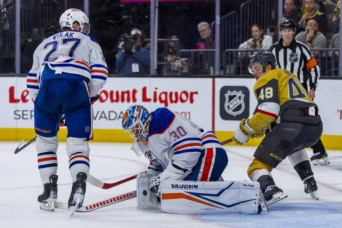 Edmonton Oilers goaltender Calvin Pickard (30) appears injured after defenseman Brett Kulak (27 ...