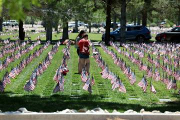 Sister Jessica Chamberlain, left, and Erica Chamberlain, both of Henderson, visits the grave of ...