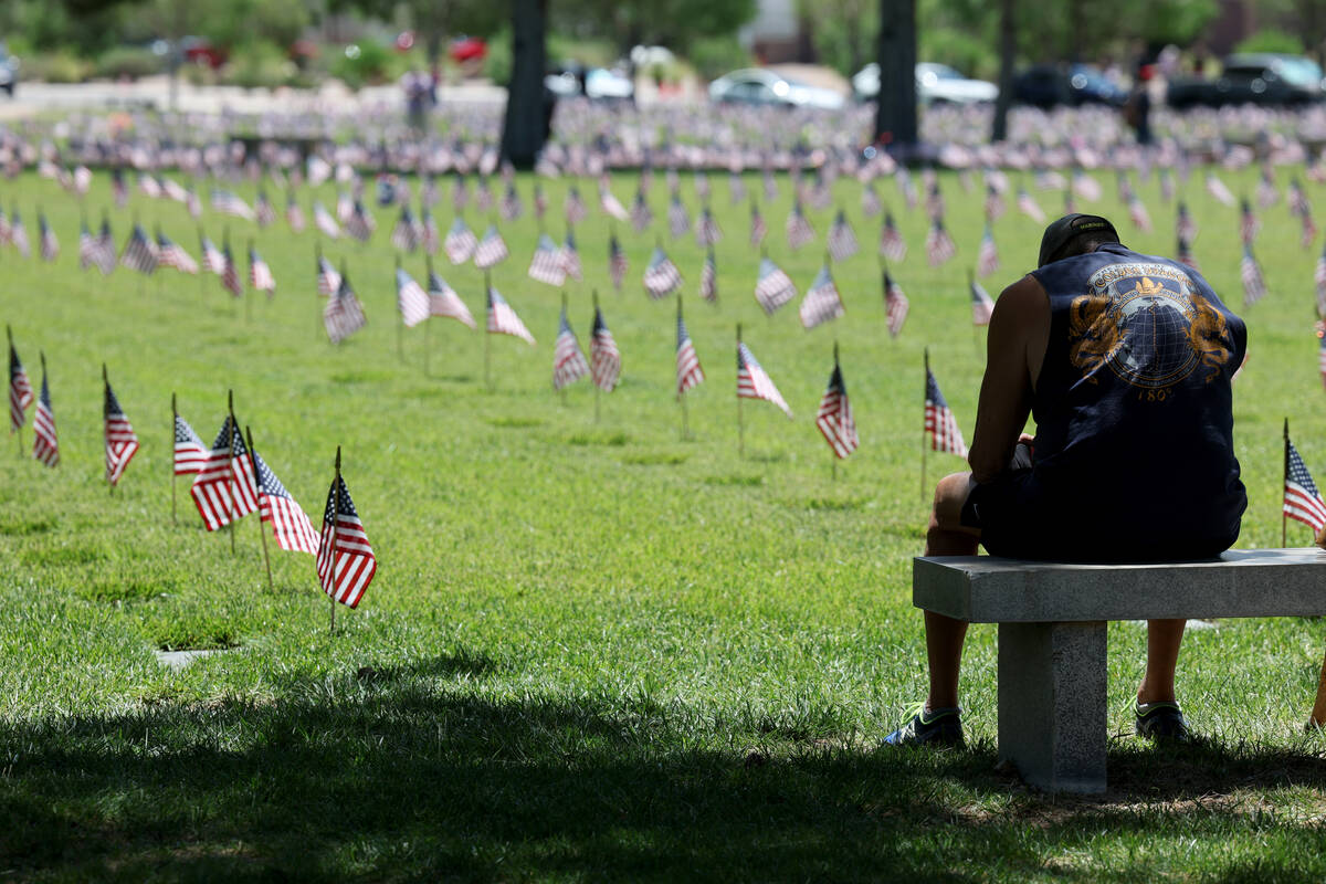 A veteran who declined to give his name pauses before the Memorial Day ceremony at the Southern ...