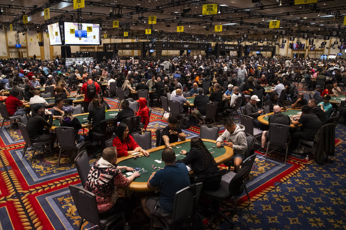 Attendees compete in the $500 industry employees no-limit hold'em event during the first day of ...