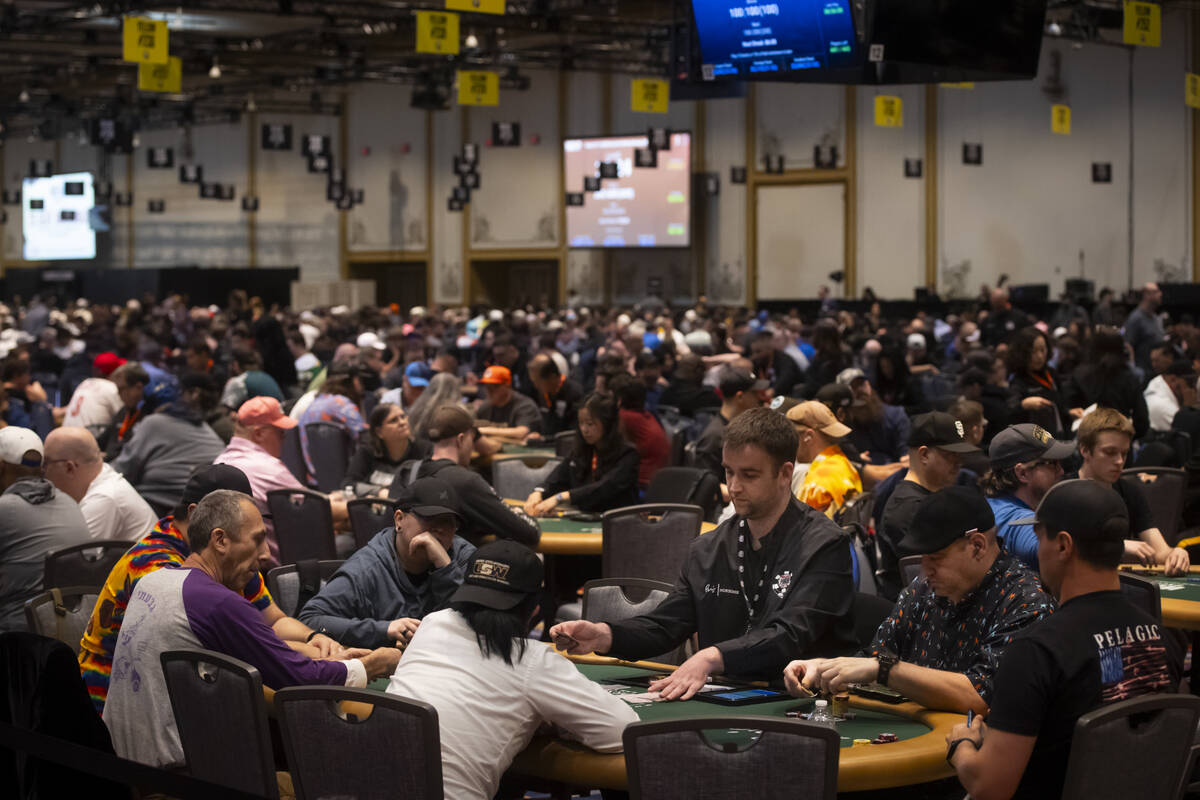 Attendees compete in the $500 industry employees no-limit hold'em event during the first day of ...