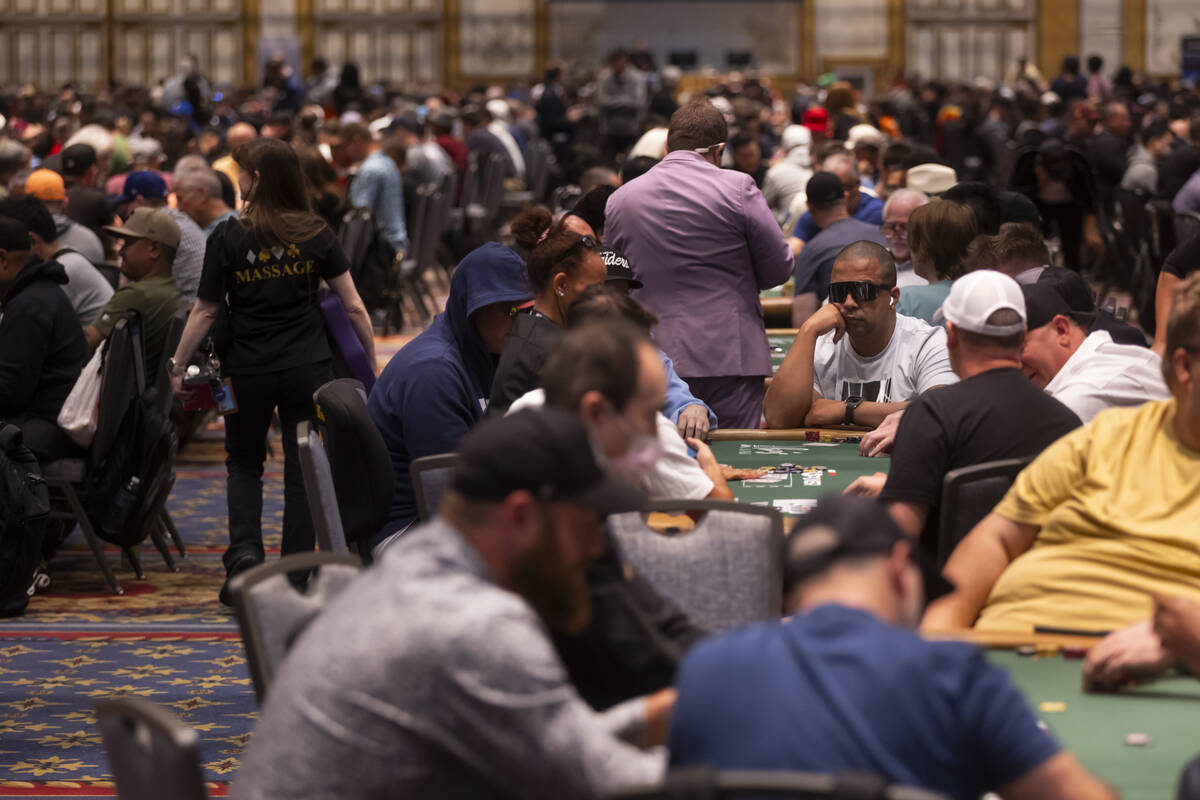 Attendees compete in the $500 industry employees no-limit hold'em event during the first day of ...